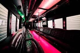 Party Bus Fleet 19 25 Passenger bus inside with red neon lights.