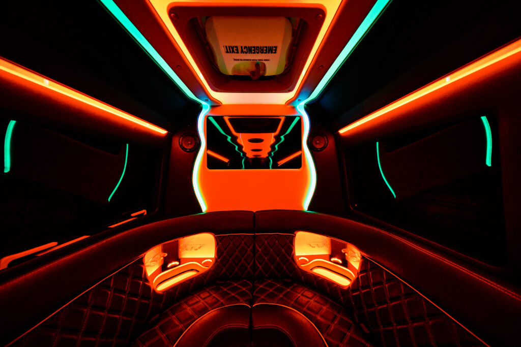 #1 Official Las Vegas Party Bus Rental Experiences 14 Futuristic car interior with neon lights