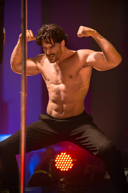 Luxury Bachelorette Party Bus Rentals Las Vegas | 702-769-0058 3 Magic Mike las vegas Dancer with a stripper pole on stage with lights.