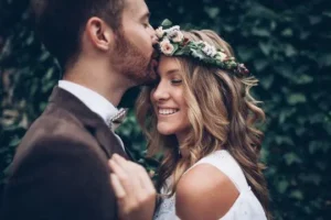Bride and groom smiling after a wedding party bus rental.