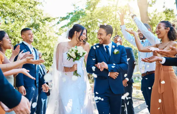 Couple celebrating with joyful guests.